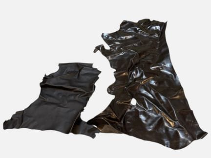 [LEATHER HANDLE]
Box containing goatskins and calf