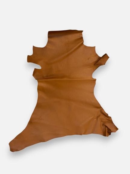 [LEATHER HANDLE]
Box containing goat hides in vari