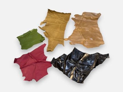 [LEATHER HANDLE]
Box containing raspberry-red and 