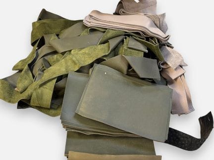 [LEATHER HANDLE]
Box containing numerous green and