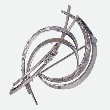 BRILLANT-BROSCHE :
Dynamisches Kleinod aus Weissgo