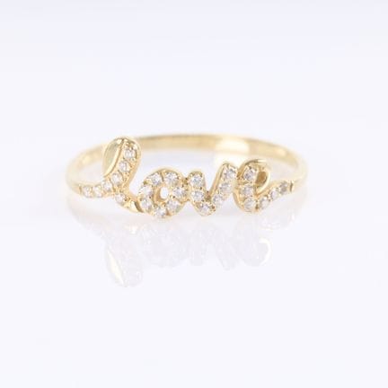 Anillo «Love» de oro con pequeñas piedras blancas 