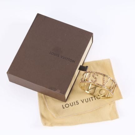 LOUIS VUITTON. Pulsera tipo esclava de metal dorad