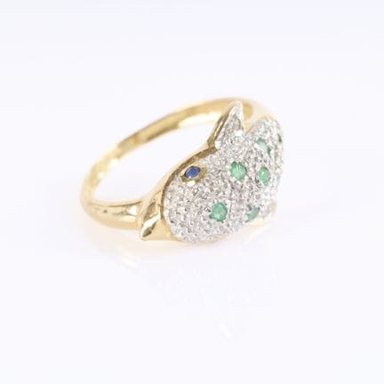 Anillo con forma de delfín de oro engastado con pe