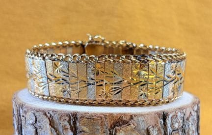 Bracelet articulé trois ors 750/1000 (18K) composé