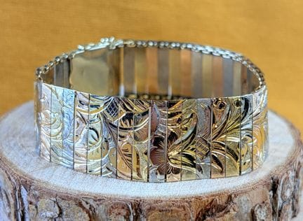 Bracciale articolato in tre tipi di oro 585/1000 (