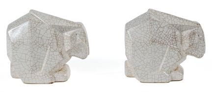 C. MANO: Coppia di fermalibri in ceramica modellat