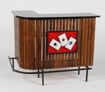 Corner bar cabinet with wooden slats, adorned with
