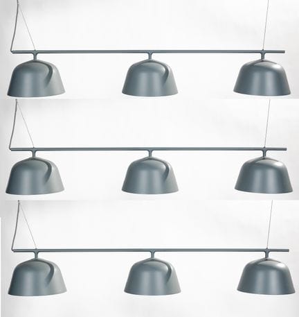 Tres lámparas colgantes de metal gris con tres glo