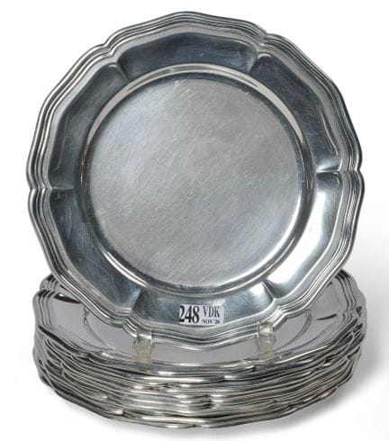 Twelve small 800/1000 silver plates with scalloped