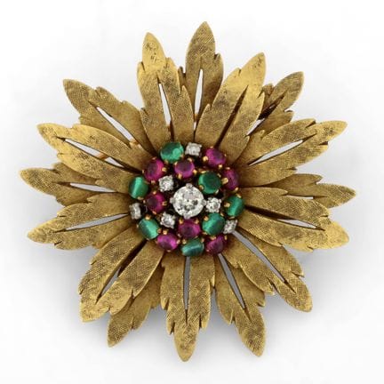 An 18-karat yellow gold "flower"-shaped brooch set