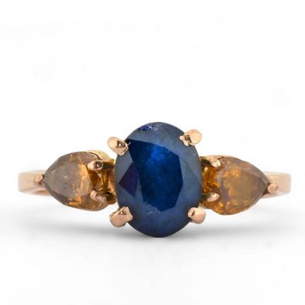 Anello in oro giallo 14 carati con uno zaffiro tag