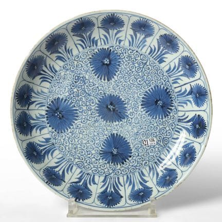 A large porcelain dish with a blue-and-white flora
