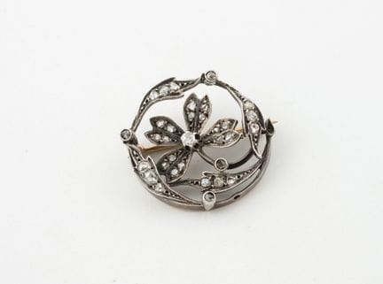 Broche redondo de oro rosa (750) y plata (800) cal