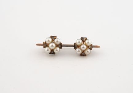 Pequeño broche de oro amarillo (750) con dos motiv