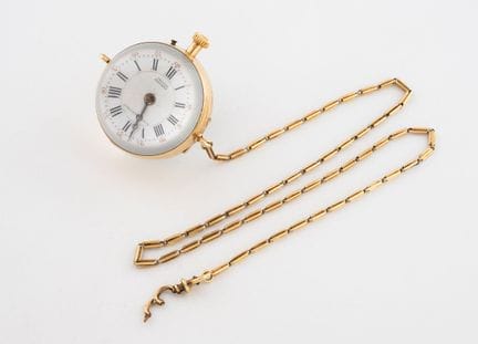 A charming globe watch made of yellow gold (750) a