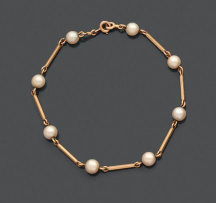 Bracciale articolato in oro giallo 750, con maglie