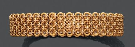 Bracciale articolato in oro giallo 750, con maglie