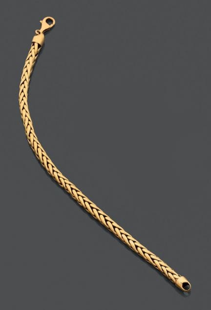Bracciale articolato in oro giallo 750, con maglie