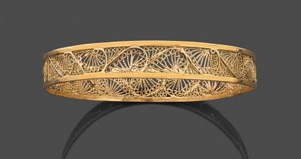 Zwei starre Armbänder aus 750er Gelbgold, jeweils 