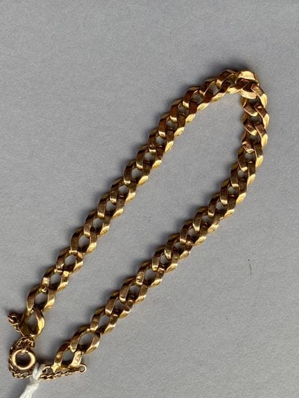 Bracciale articolato in oro giallo 750, con maglie