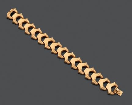 Bracciale articolato in oro giallo 750, con maglie