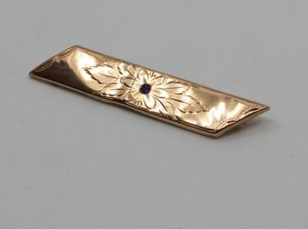 Broche tipo horquilla de oro amarillo (375/00) cin