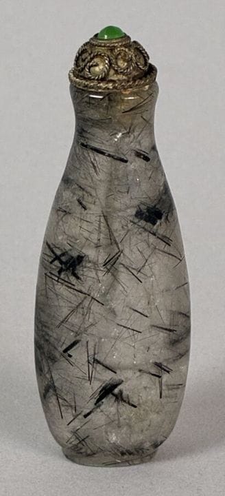 Rock crystal snuff bottle with black tourmaline in