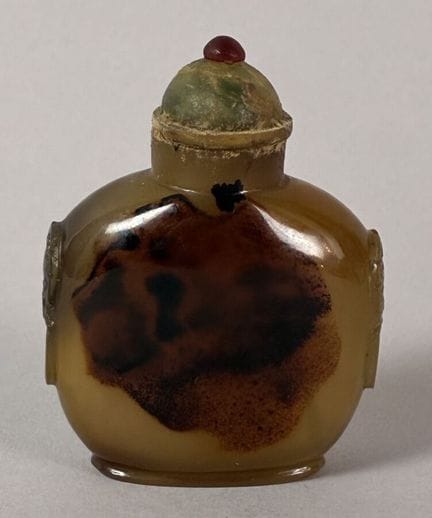 Honey-brown agate snuff bottle. Slight chip at the