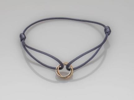 CARTIER, cord bracelet, adorned with the three Tri