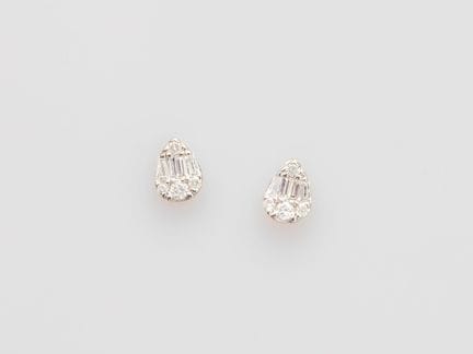 Pair of platinum teardrop earrings, set with trape