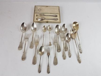 Assortment of mismatched silver cutlery, including