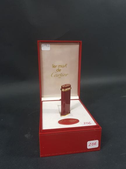 CARTIER Must - Gold-plated gas lighter with red la