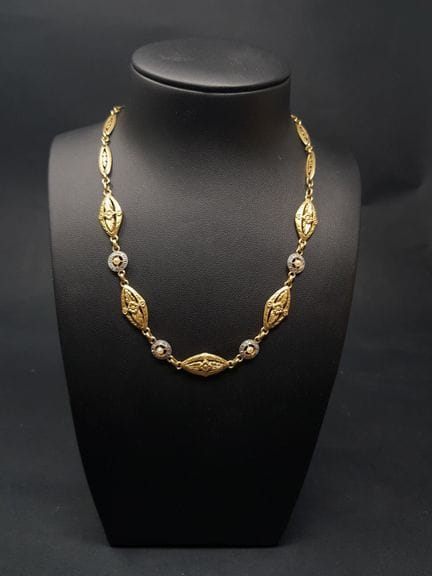 Collana a drappeggio in due tipi di oro 750e, comp