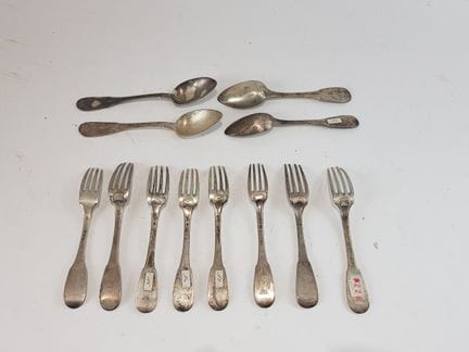 Four spoons and eight mismatched silver forks—19th