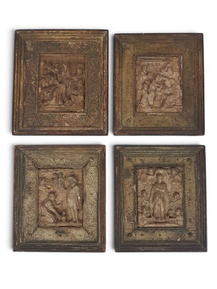 Four alabaster panels carved with scenes from the 