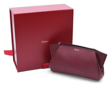 *CARTIER
Pochette in pelle bordeaux, sacchetto pro