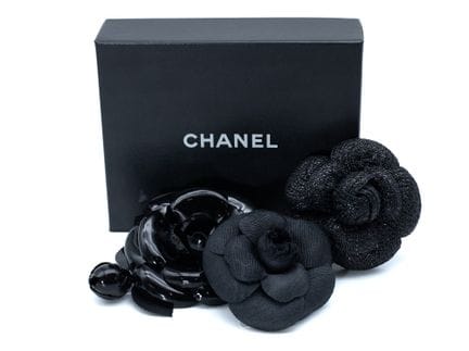 *CHANEL 
Lot of three black camellia brooches in v