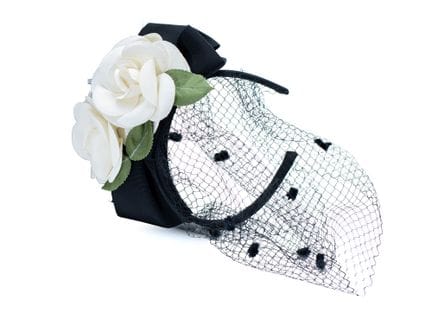 *SOPHIE HENDERSON
Black grosgrain headband with a 