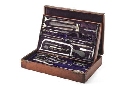 Mahogany case containing two trays of surgical ins