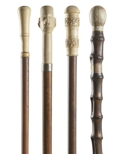 19th-20th-century art. Four walking sticks with iv