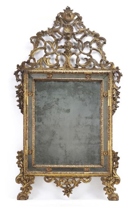 Carved and gilded wood mirror with lateral leaf an