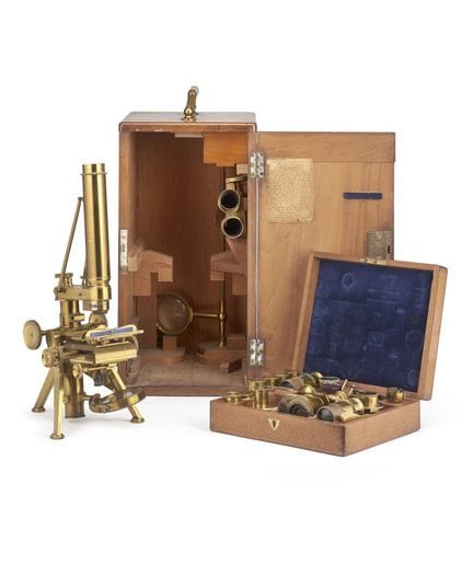 Binocular and monocular microscope marked 'Powell 