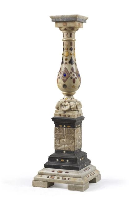 White and black marble pedestal stand, with a balu