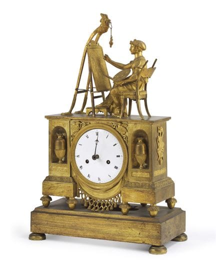Reloj de sobremesa con una figura alegórica de bro
