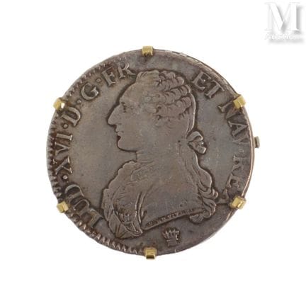 Broche pièce
Broche en or jaune 18K (750°/°°) et a