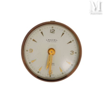 LANCEL
Round travel alarm clock, dial with metal b