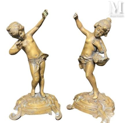 Dos figuras de bronce
cinceladas y doradas 
Dimens
