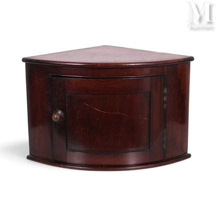 CLAUDE FRANCOIS
A small mahogany corner cabinet, p