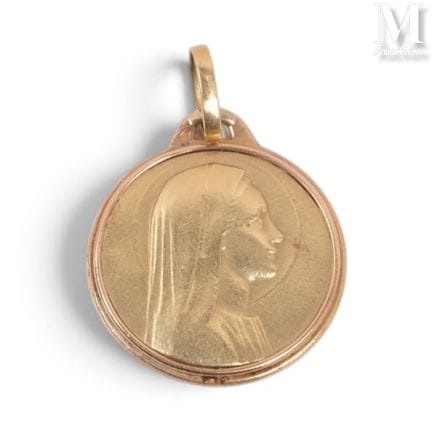 Religious gold medal with an inscription on the ba